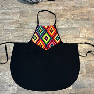 Women’s black apron with colorful Aztec design